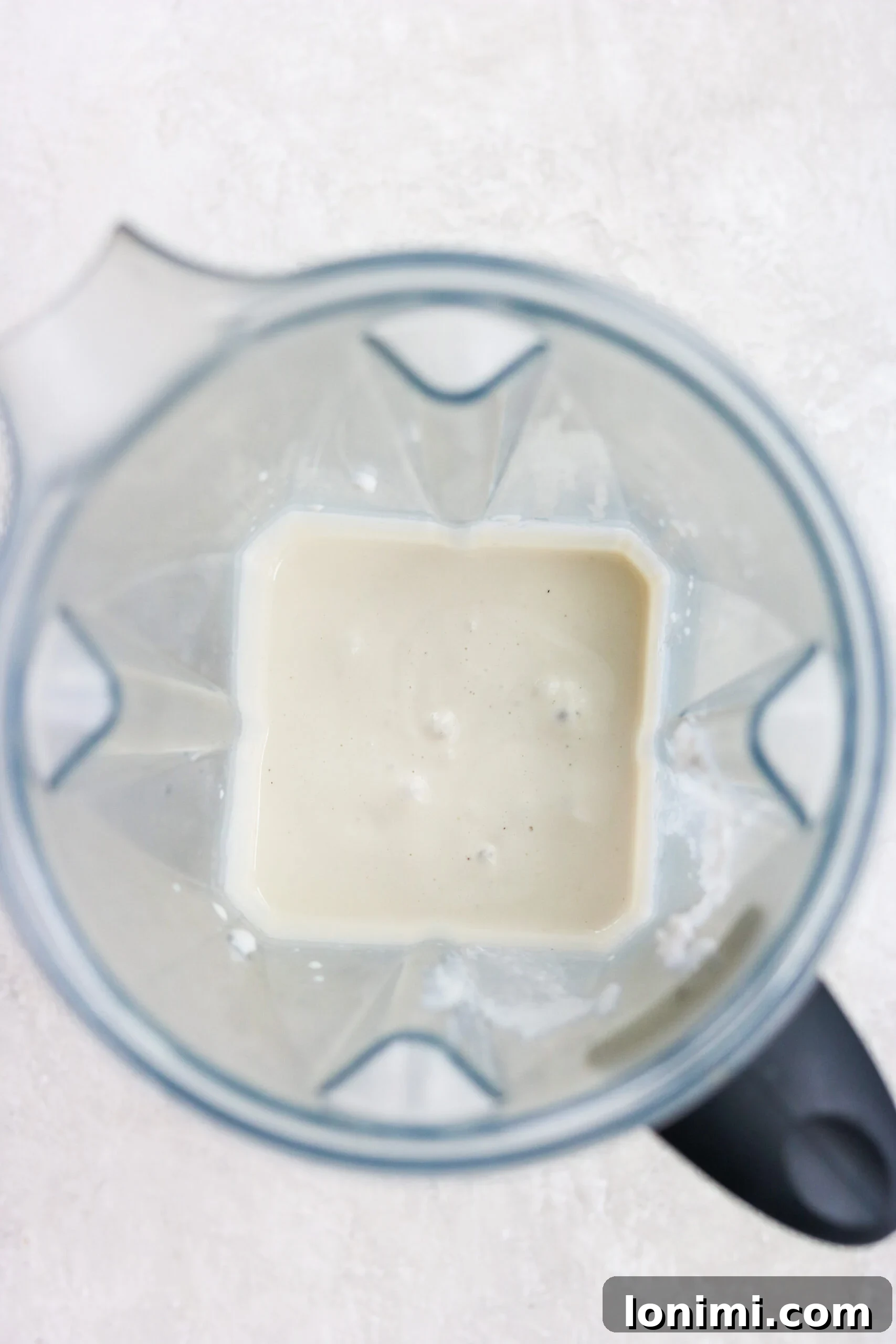 overhead view of a blender with blended recipe ingredients