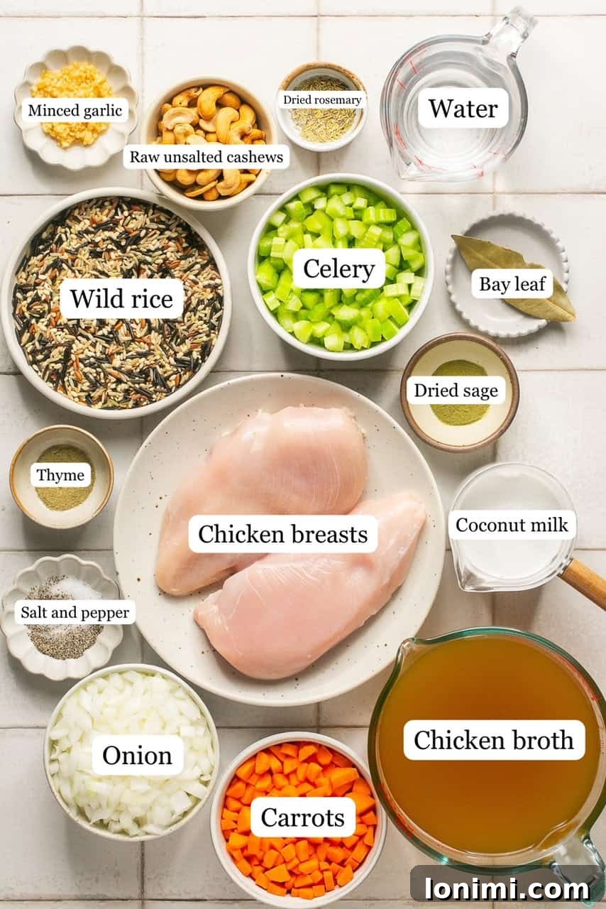 Your Favorite Panera Chicken and Wild Rice Soup Made Gluten Free 3 Small bowls containing various recipe ingredients like diced chicken, chopped vegetables, wild rice, and spices, all clearly labeled.