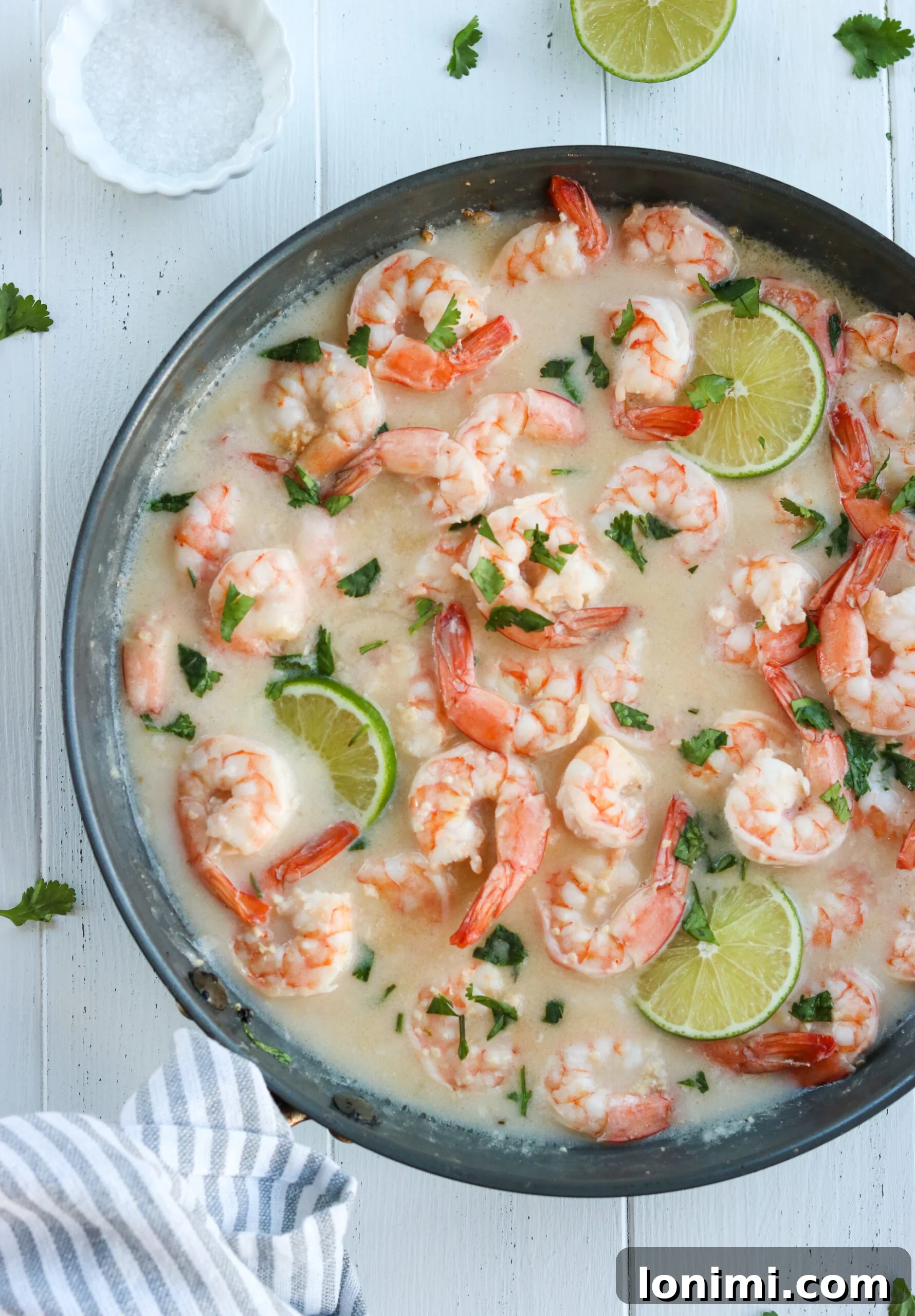 Zesty Whole30 Coconut Lime Shrimp 2 A beautifully plated Whole30 Coconut Lime Shrimp Skillet with fresh cilantro garnish, served over cauliflower rice.