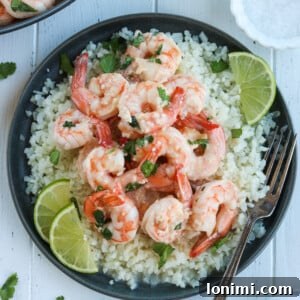 Zesty Whole30 Coconut Lime Shrimp 8 A bowl of creamy coconut lime shrimp with fresh cilantro.