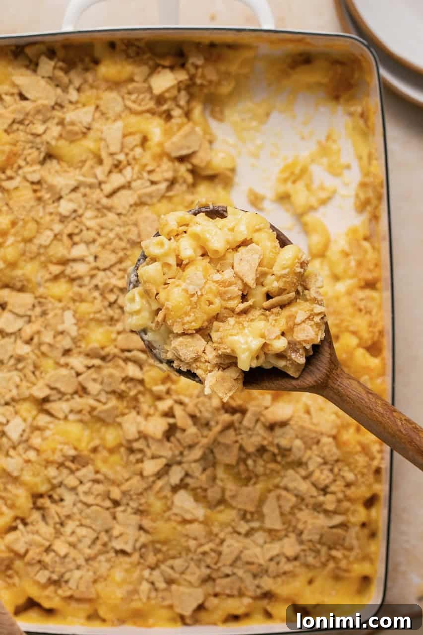 No-Fuss Gluten-Free Oven-Baked Mac and Cheese Perfection 2 Baked gluten-free mac and cheese in a casserole dish, topped with golden-brown crackers, ready to be served.