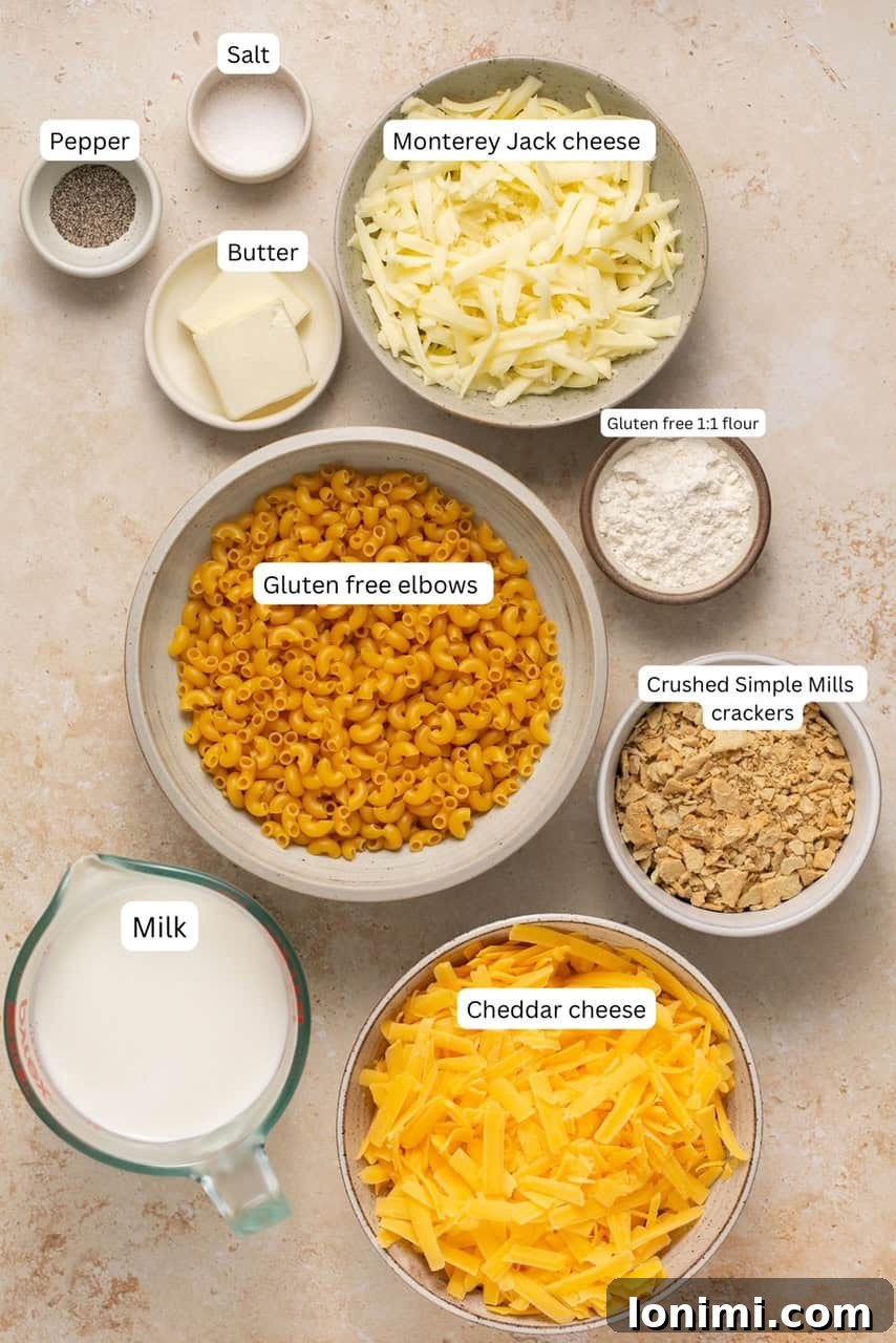 No-Fuss Gluten-Free Oven-Baked Mac and Cheese Perfection 3 Ingredients for baked gluten free mac and cheese displayed in individual nesting bowls, including cheese, pasta, flour, butter, and milk.