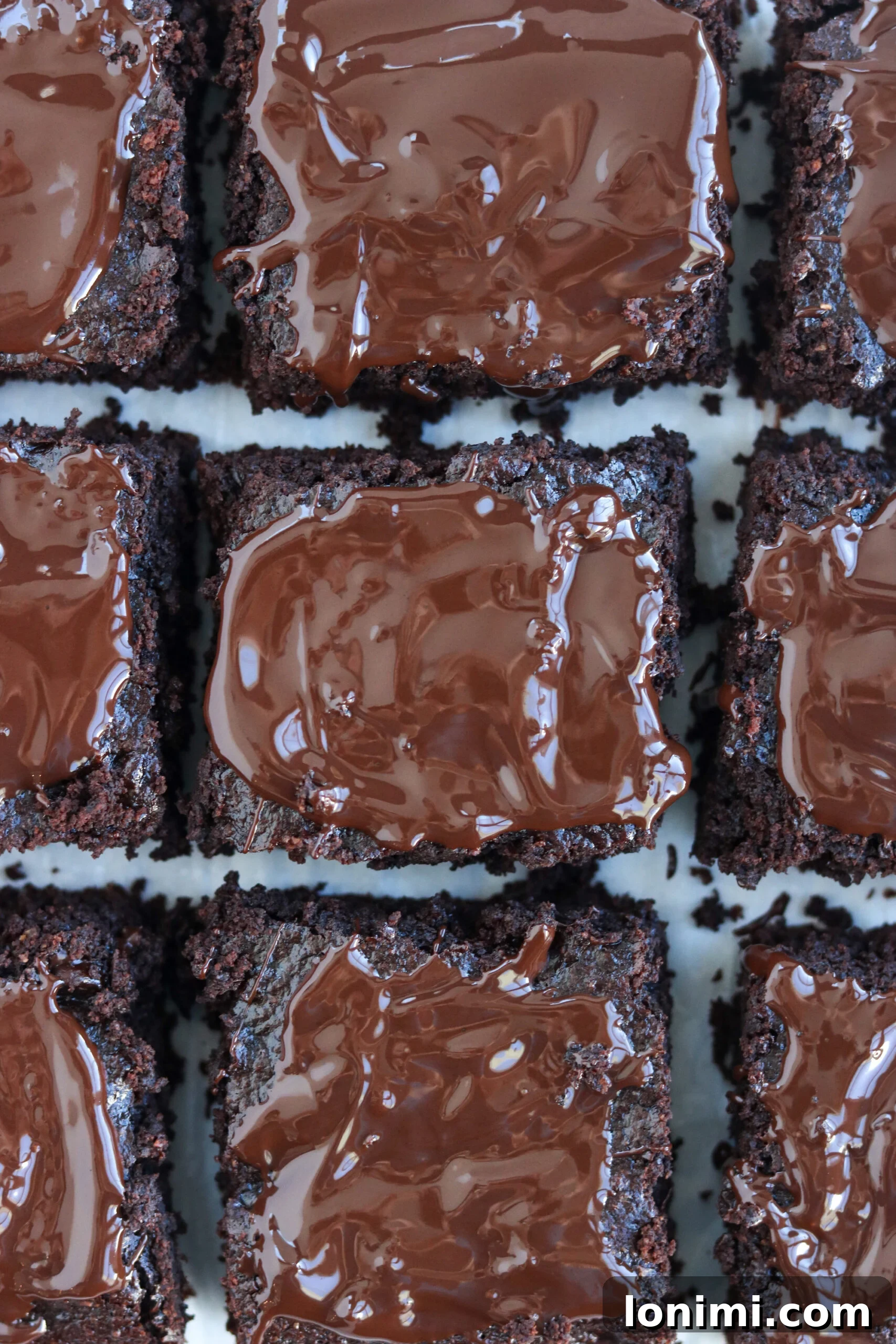 A top-down view of luscious chocolate brownies in a baking pan, ready to be sliced and served.