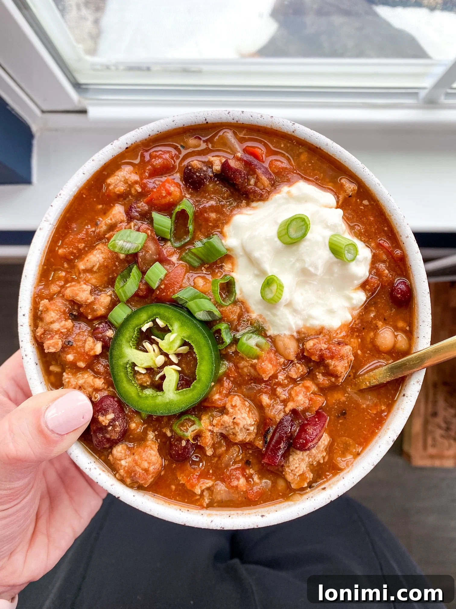 person holding a bowl of food