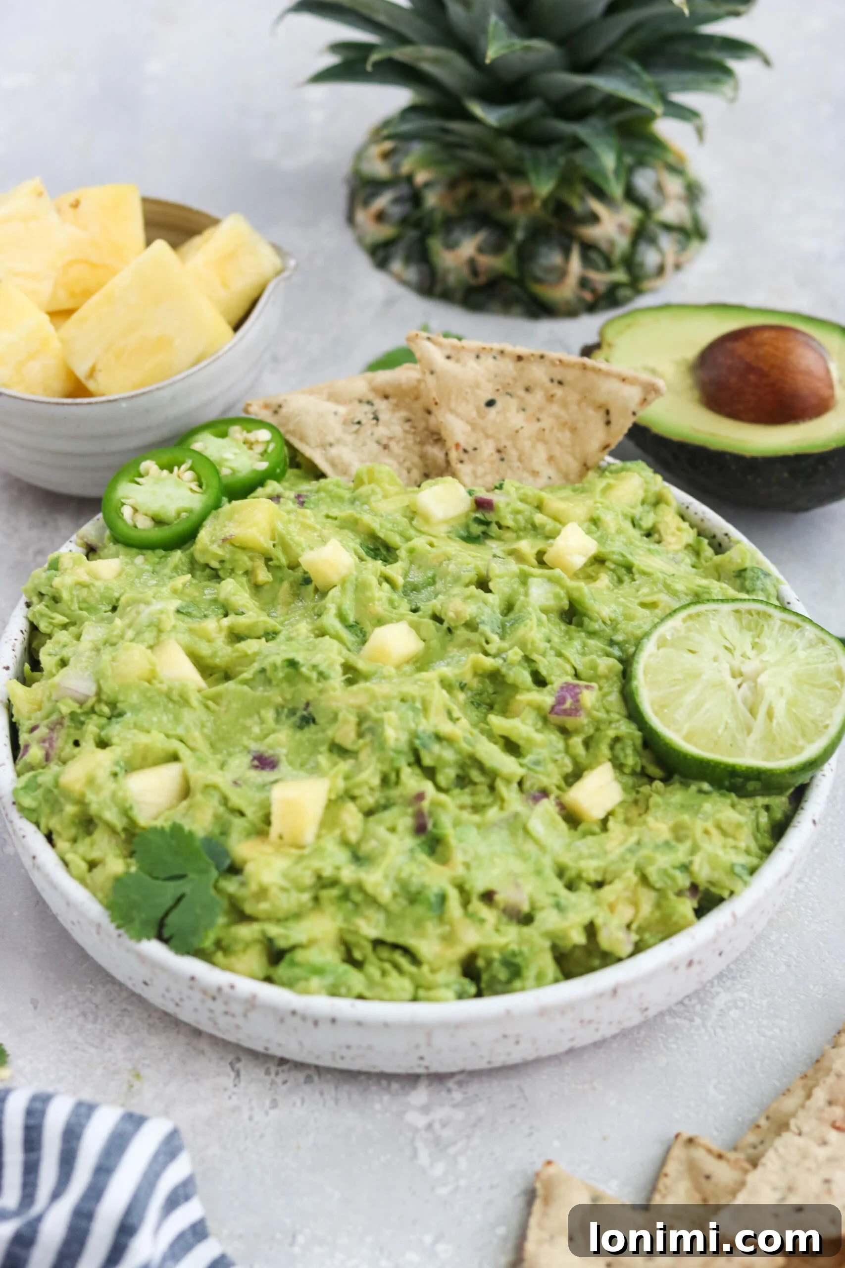 Close-up of freshly made Paleo Pineapple Guacamole in a bowl, ready to be served