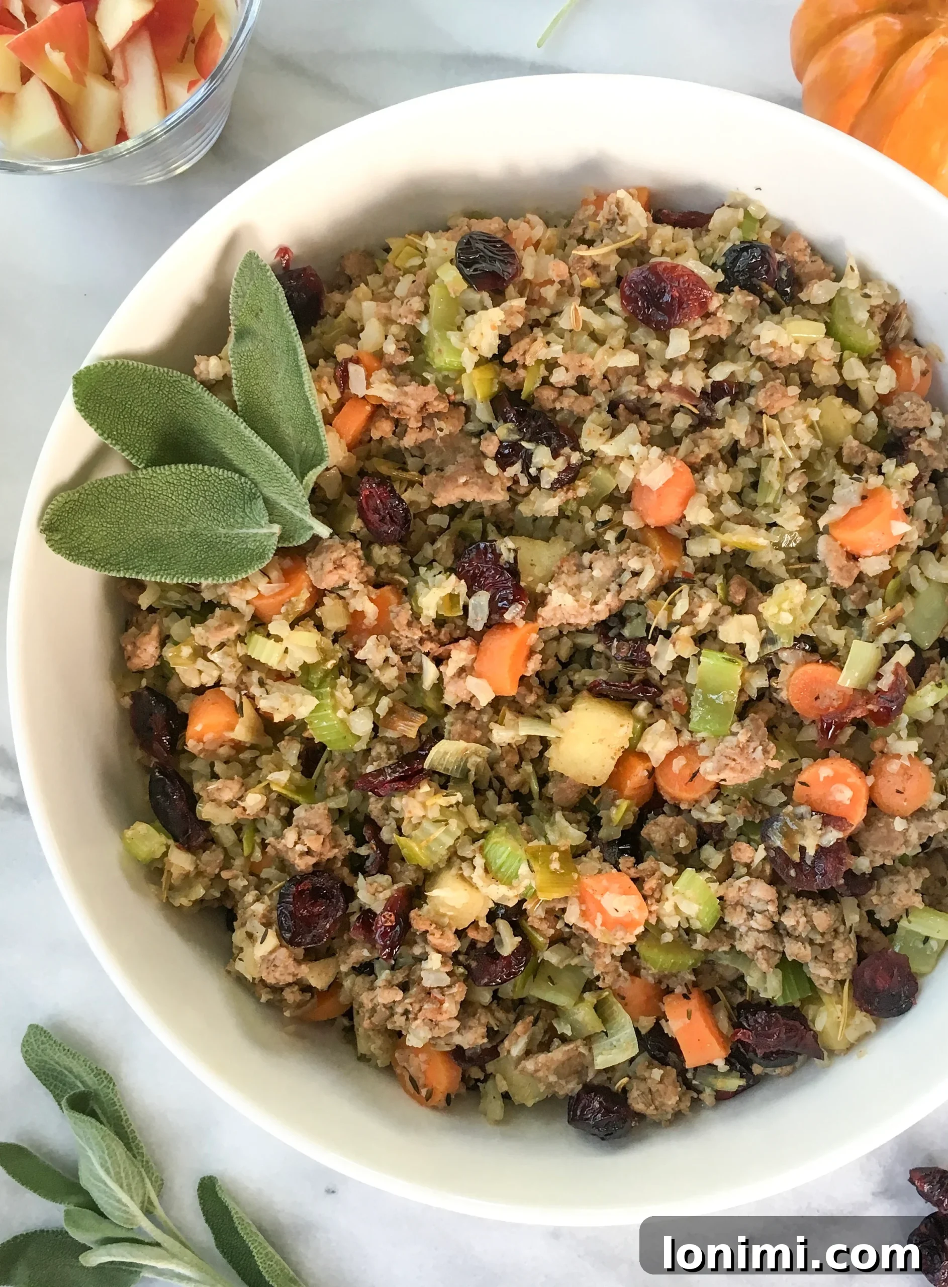 Savory Sausage Cauliflower Rice Stuffing Whole30 Keto Paleo 2 low carb cauliflower stuffing with homemade sausage garnished with fresh sage