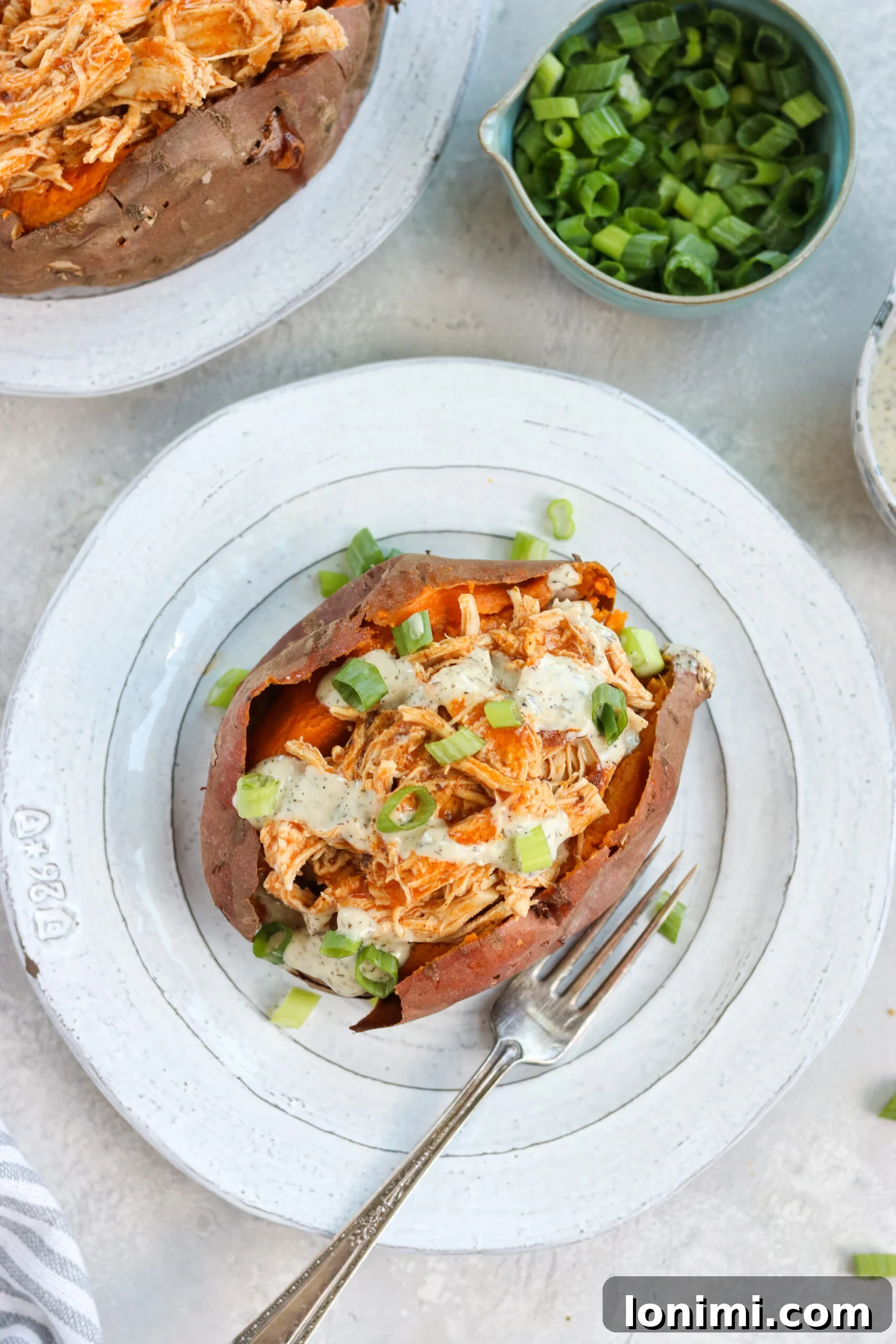 Baked sweet potato with stuffing Baked Sweet Potato with Spicy Buffalo Chicken Stuffing
