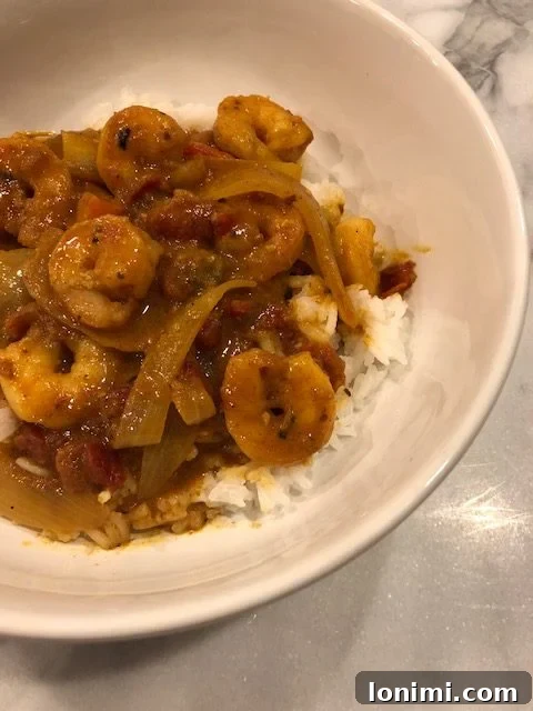 Whole30 Approved Shrimp Tikka Masala 3 Whole30 Shrimp Tikka Masala plated with a side of rice
