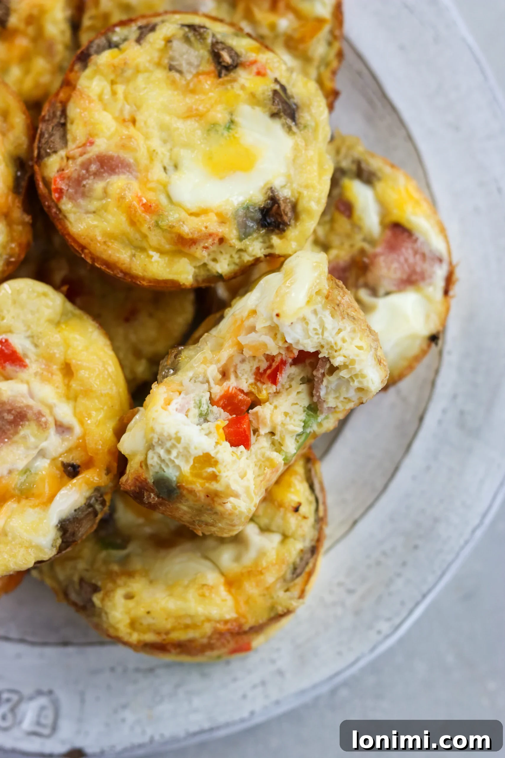 Western Omelette Egg Bites on a white plate Western Omelette Egg Bites on a white plate