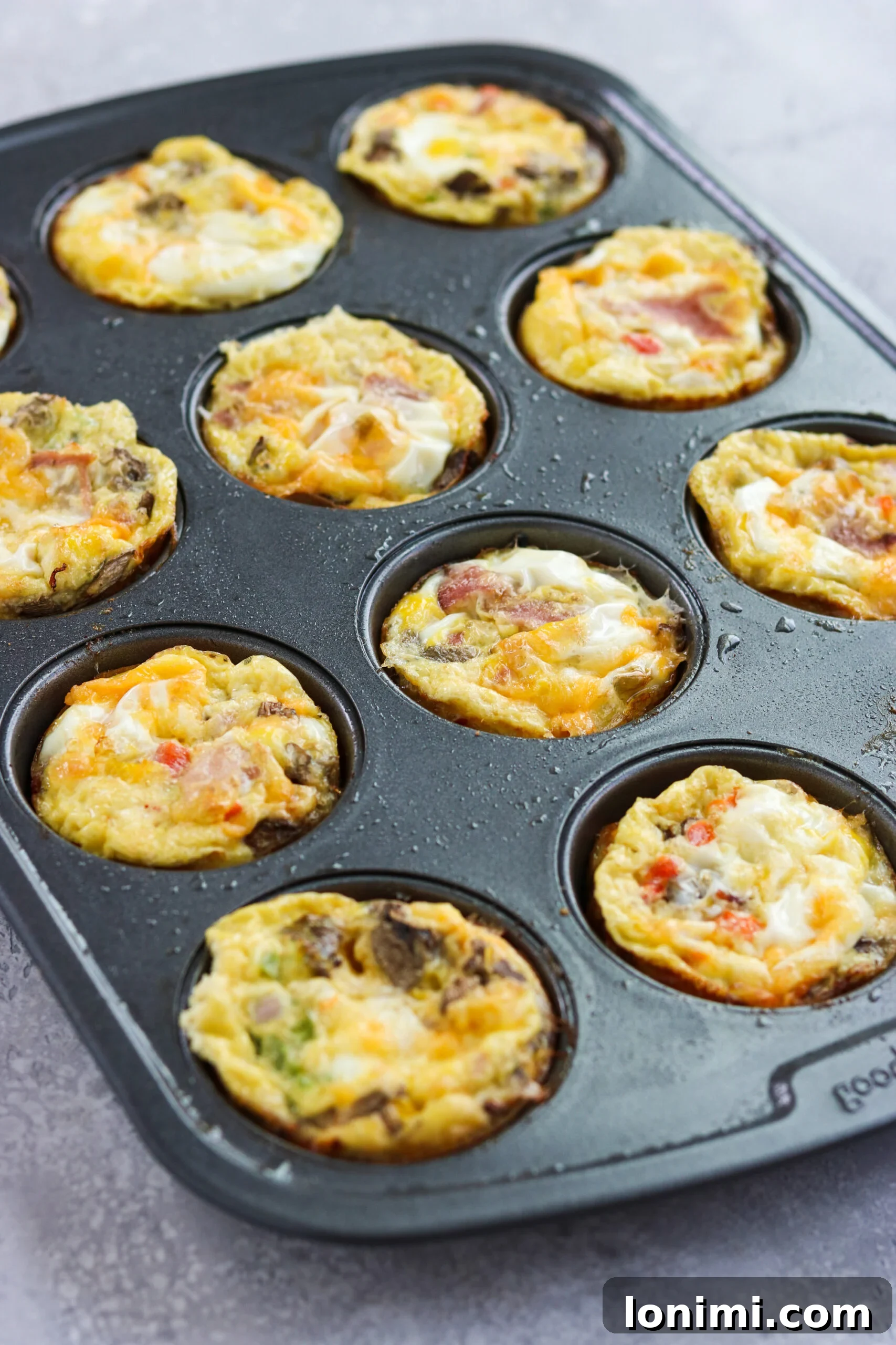 Western Omelette Egg Bites on a baking pan Western Omelette Egg Bites on a baking pan