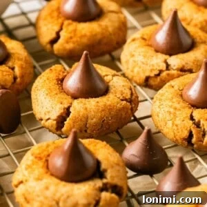 Foolproof Gluten Free Peanut Butter Blossoms 8 gluten free peanut butter blossoms on a cooling rack