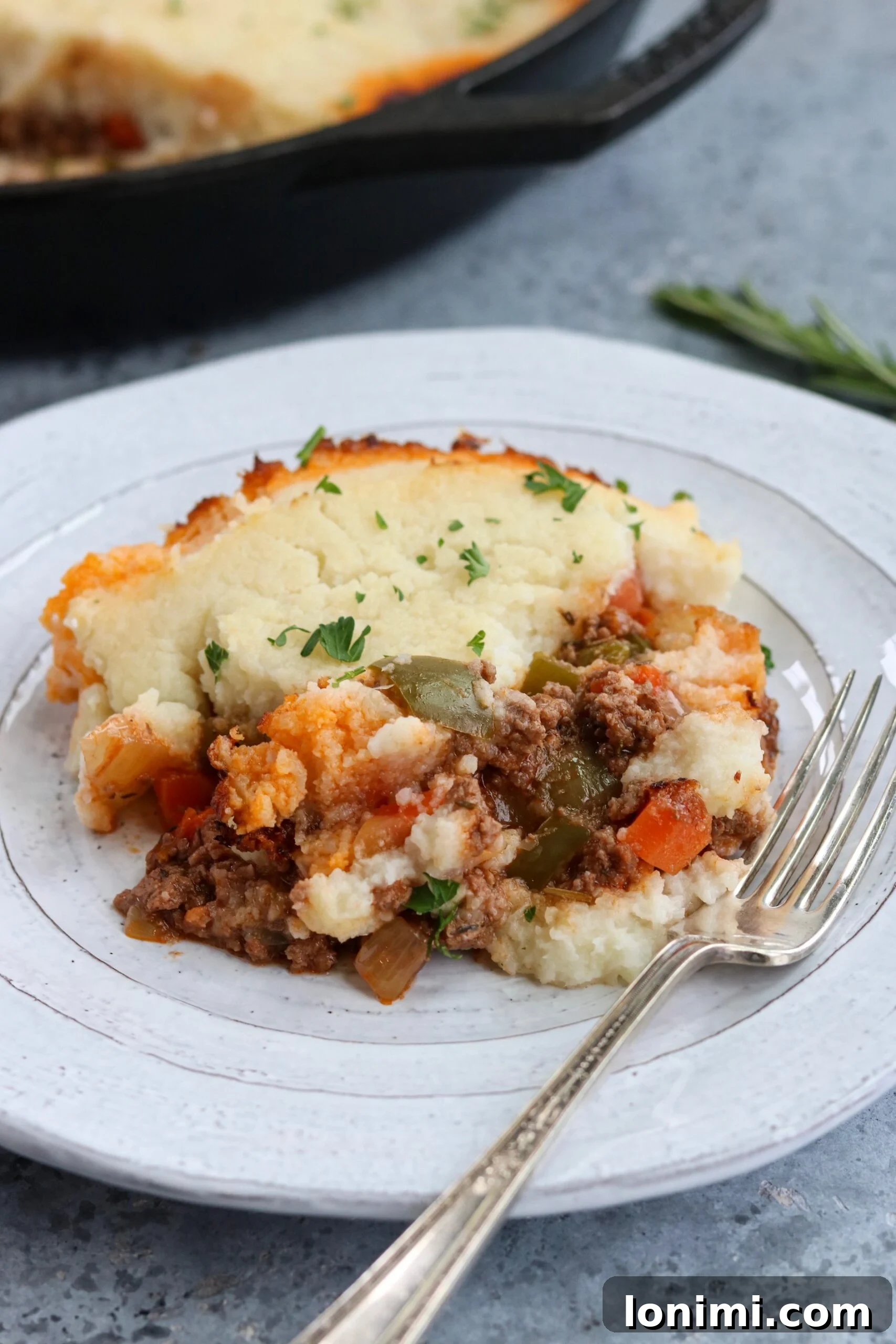 Delicious Whole30 + Keto Skillet Shepherd's Pie with golden cauliflower topping