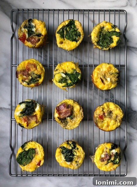 Savory BLT Egg Muffins 3 Closeup of freshly baked BLT Egg Cups in a muffin tin, showing delicious fillings