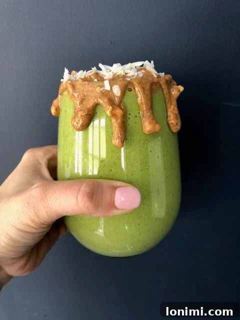 Paradise Green Elixir 2 Tropical Green Smoothie ingredients being blended