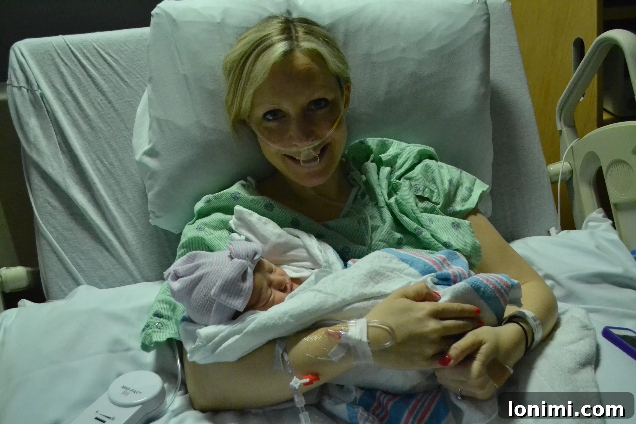 Newborn Annabel being held by her parents in the hospital.
