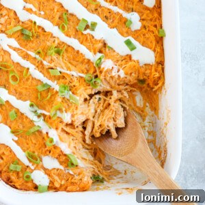 Guilt-Free Buffalo Chicken Spaghetti Squash Bake 7 Close-up of the Buffalo Chicken Spaghetti Squash Casserole, showcasing its creamy texture and rich buffalo sauce.