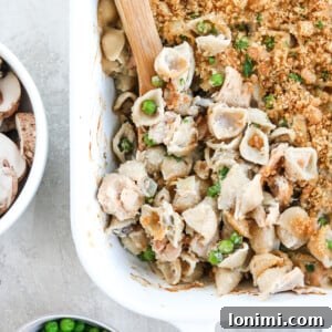 Gluten Free Tuna Noodle Casserole with peas and mushrooms, a close-up view.