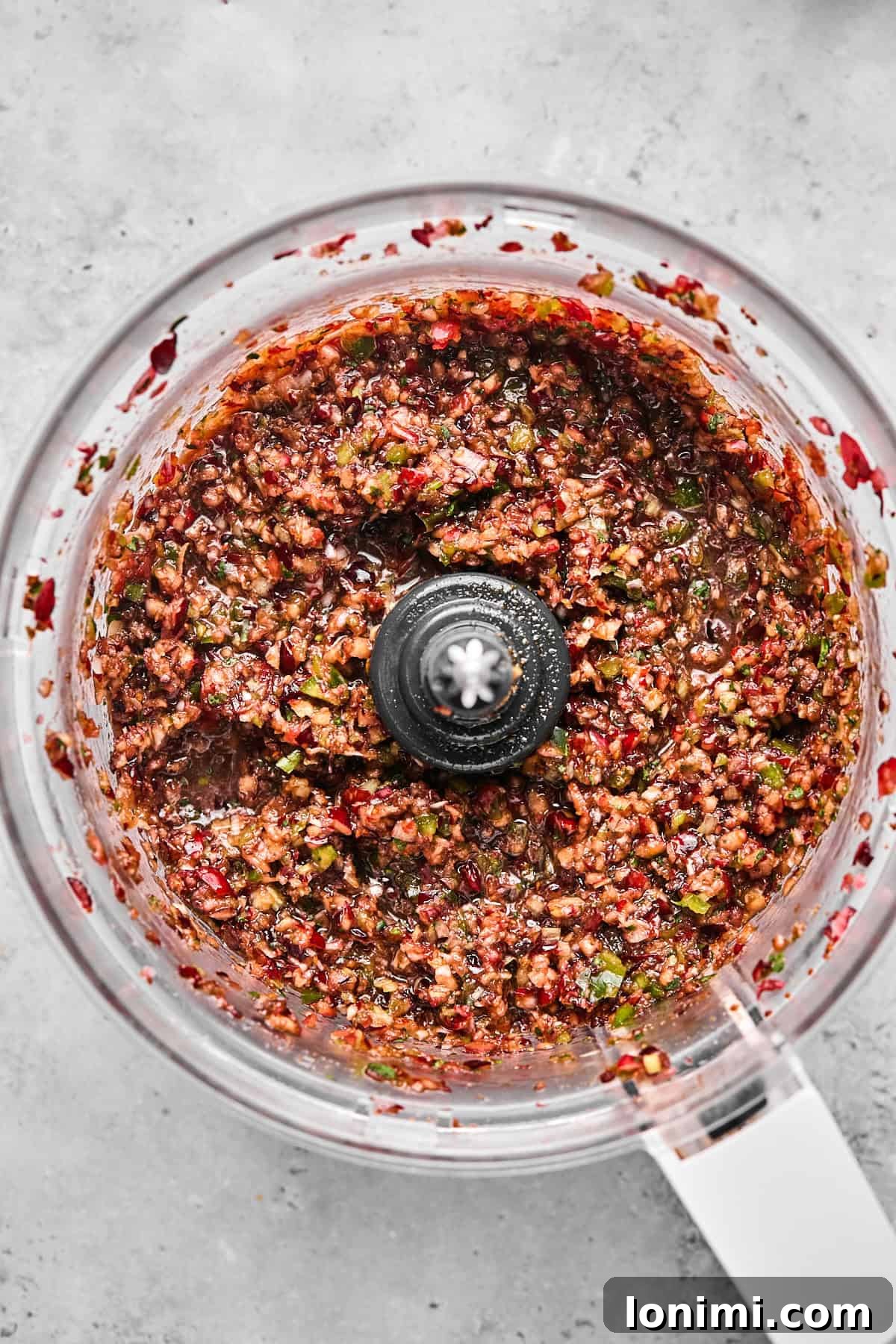 Dairy-Free Cranberry Jalapeno Dip: The Perfect Sweet Heat 7 cranberry jalapeno dip topping in a food processor