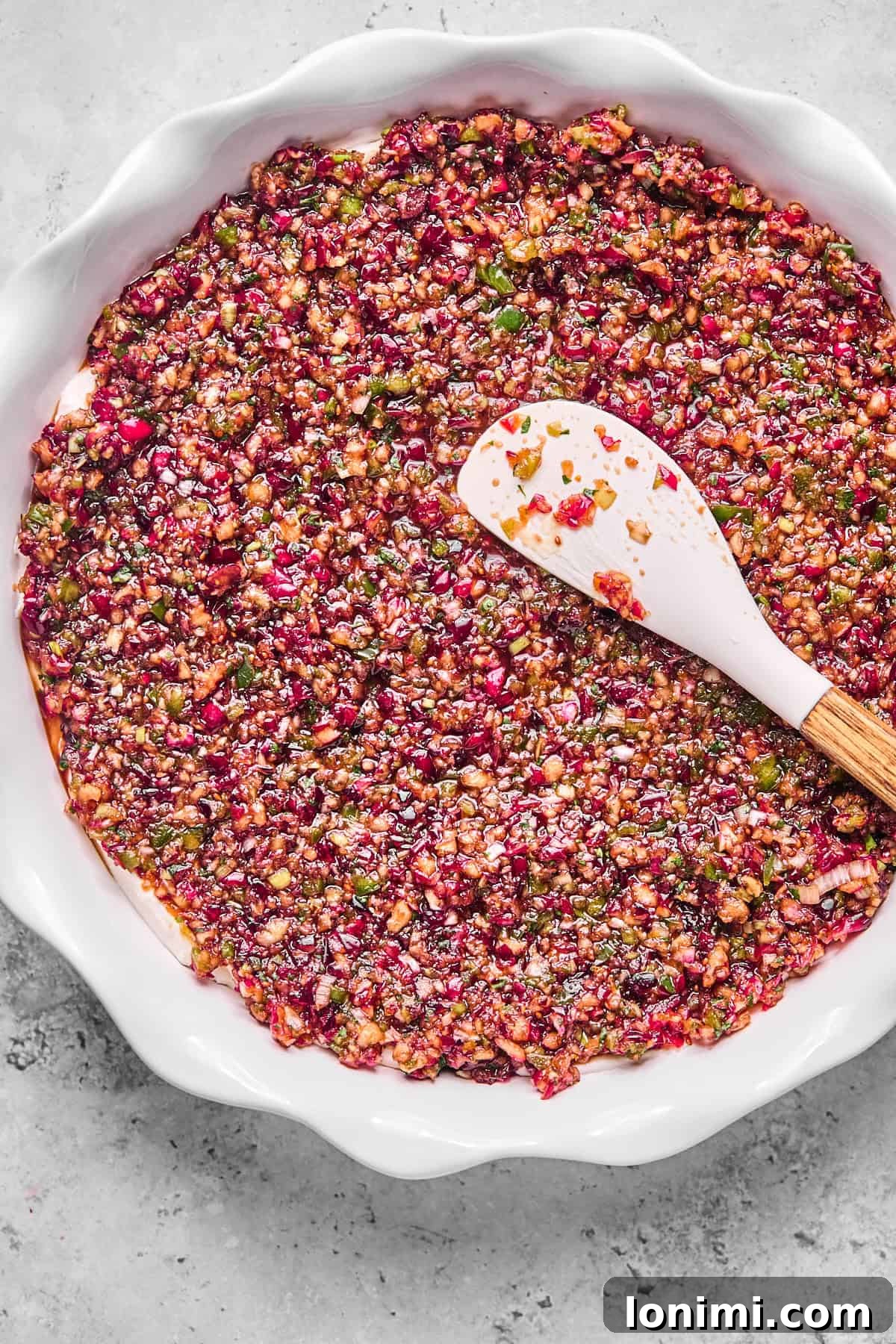 Dairy-Free Cranberry Jalapeno Dip: The Perfect Sweet Heat 9 cranberry jalapeno cream cheese dip in a white pie dish