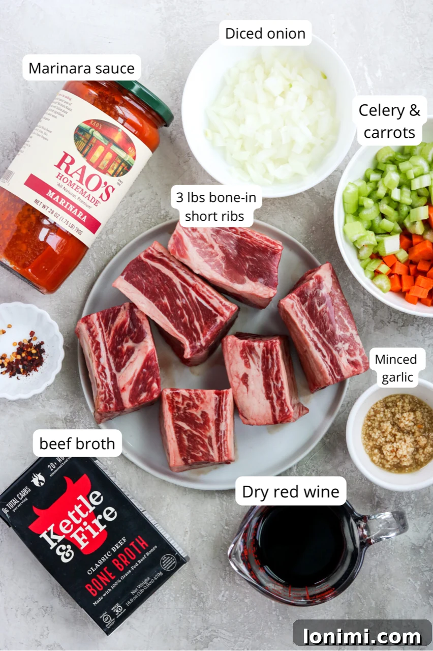 A selection of fresh ingredients laid out, including bone-in short ribs, diced vegetables (carrots, celery, onion), garlic, red wine, marinara sauce, and beef broth, ready for making short rib ragu.
