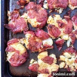 Crispy Herb Ghee Smashed Potatoes, ready to eat.