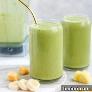 Tropical Green Smoothie with mango, banana, and pineapple