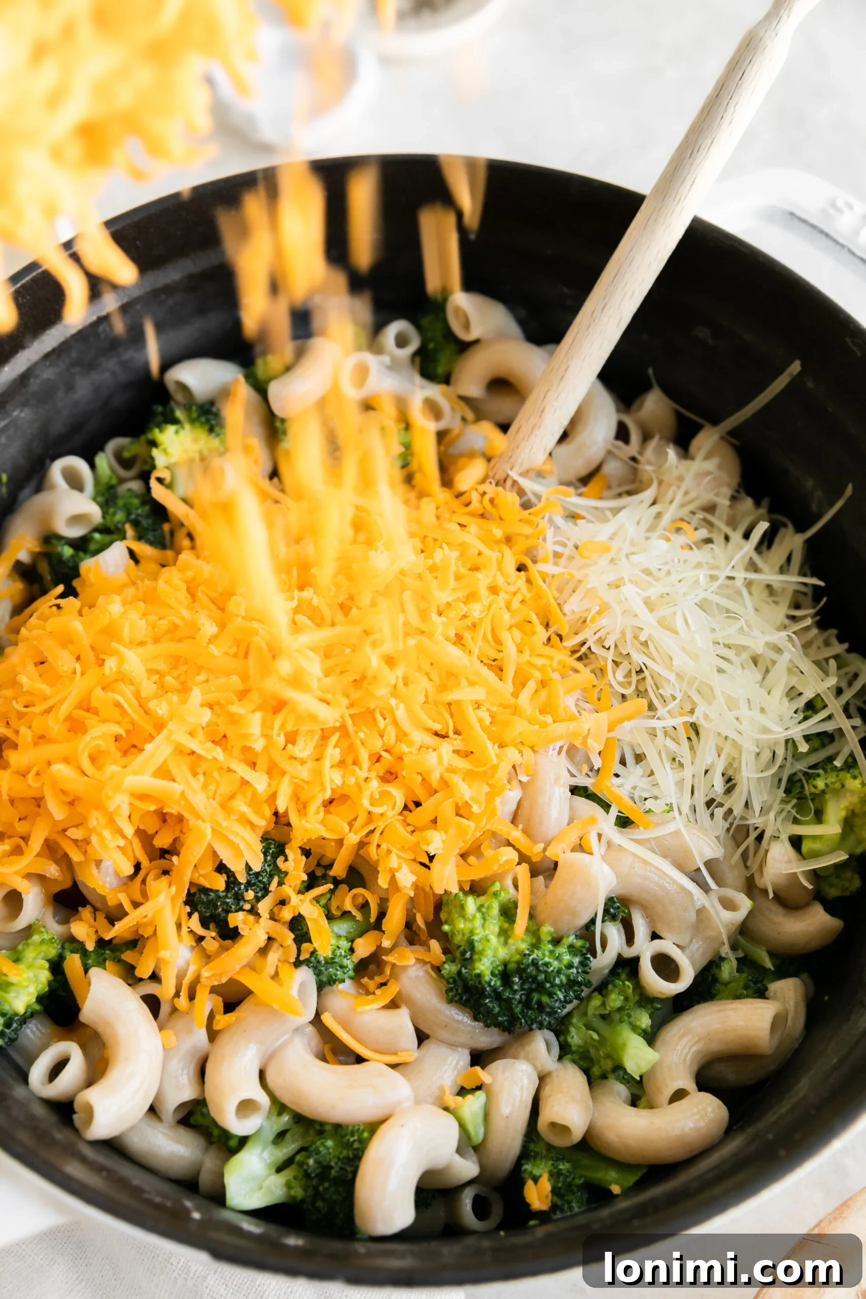 and large pot filled with the ingredients to make gluten-free mac and cheese