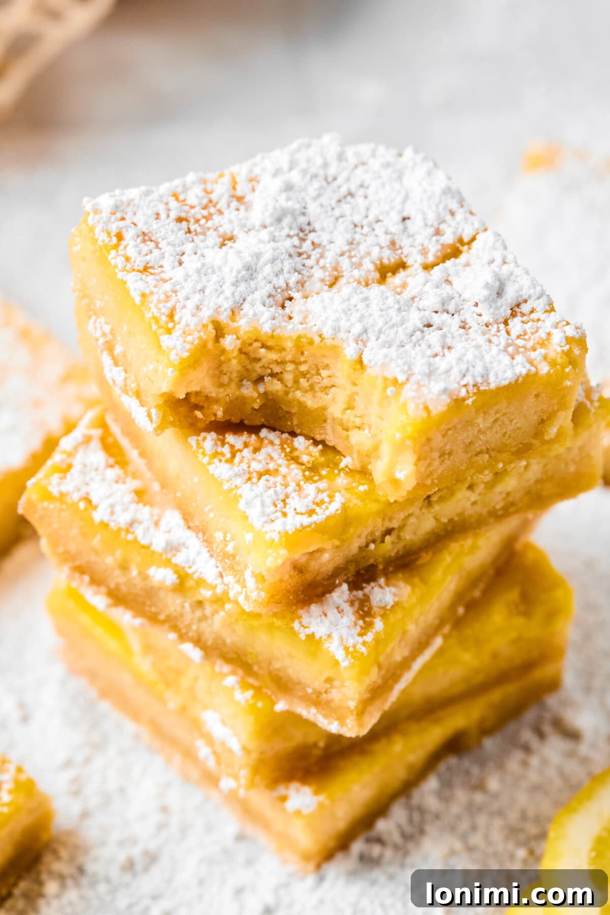 gluten free lemon bars stacked on top of each other