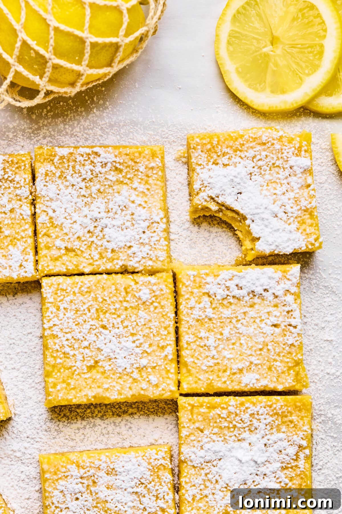 lemon bars with one with a bite taken out