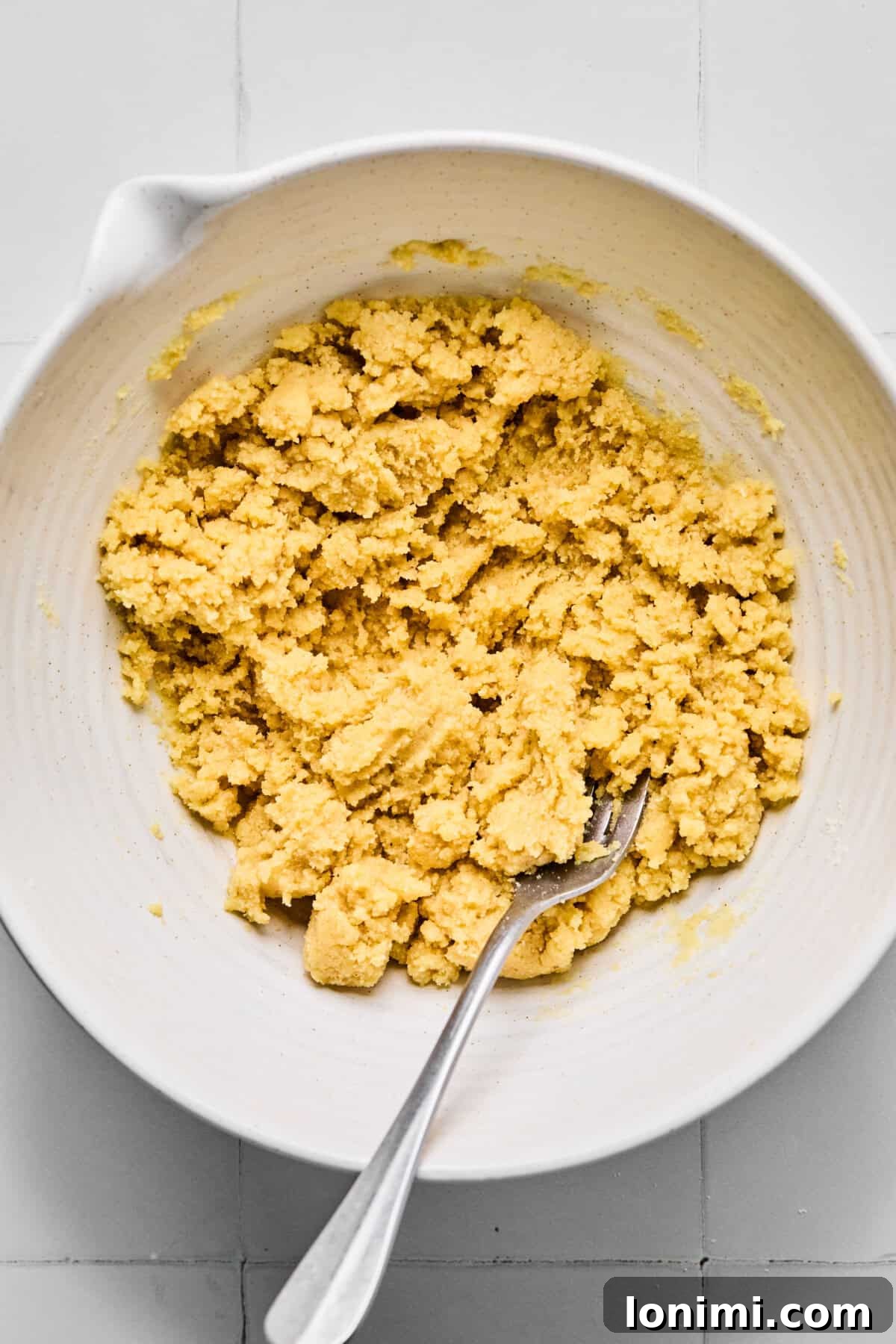 almond flour crust ingredients mixed in a bowl