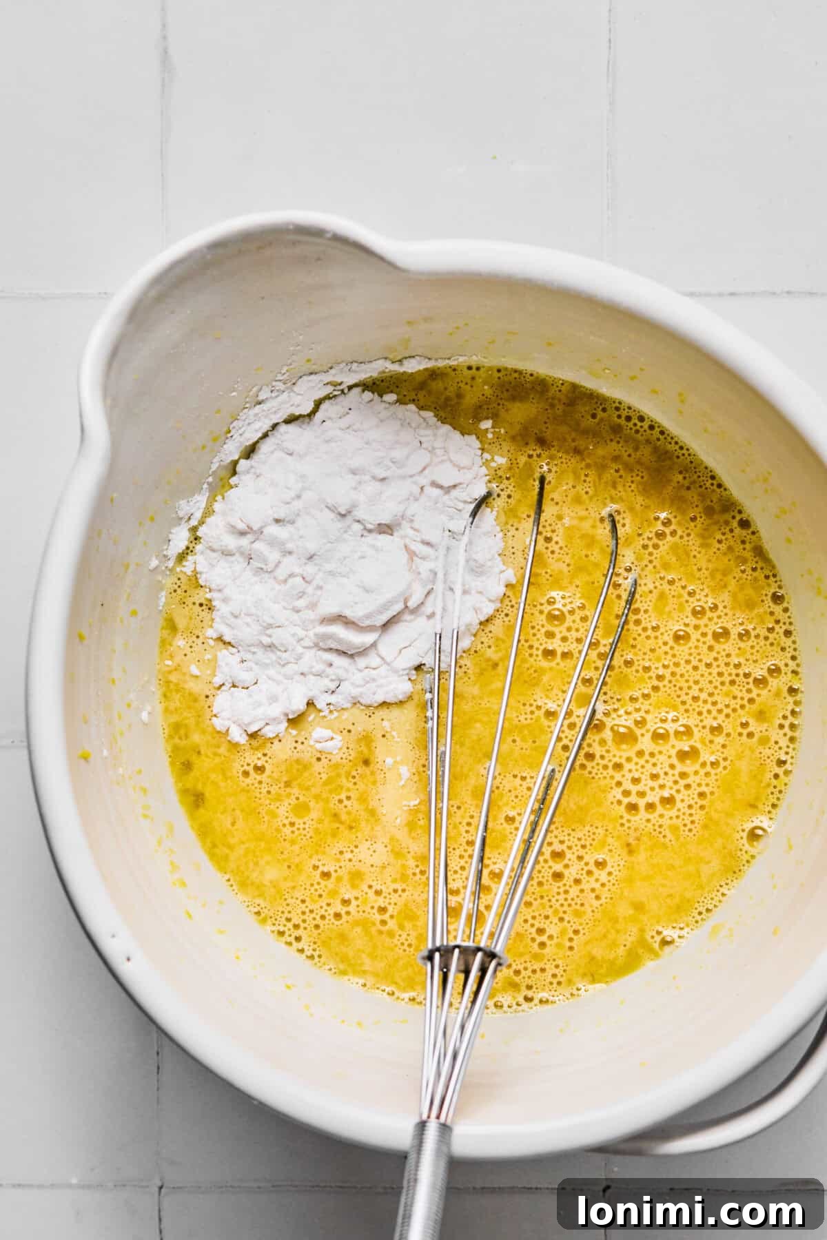 egg and lemon mixture in a bowl with tapioca flour