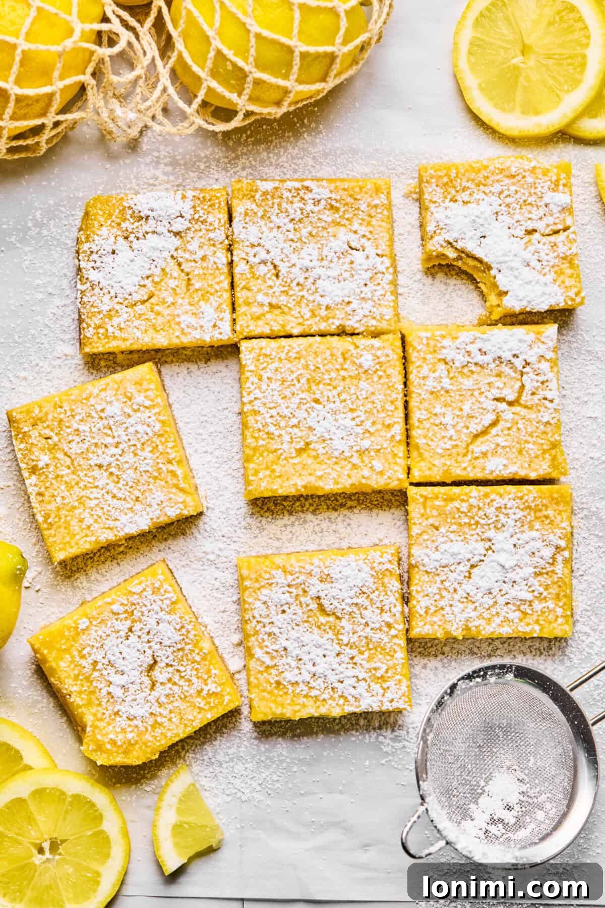 9 lemon bars dusted with powdered sugar