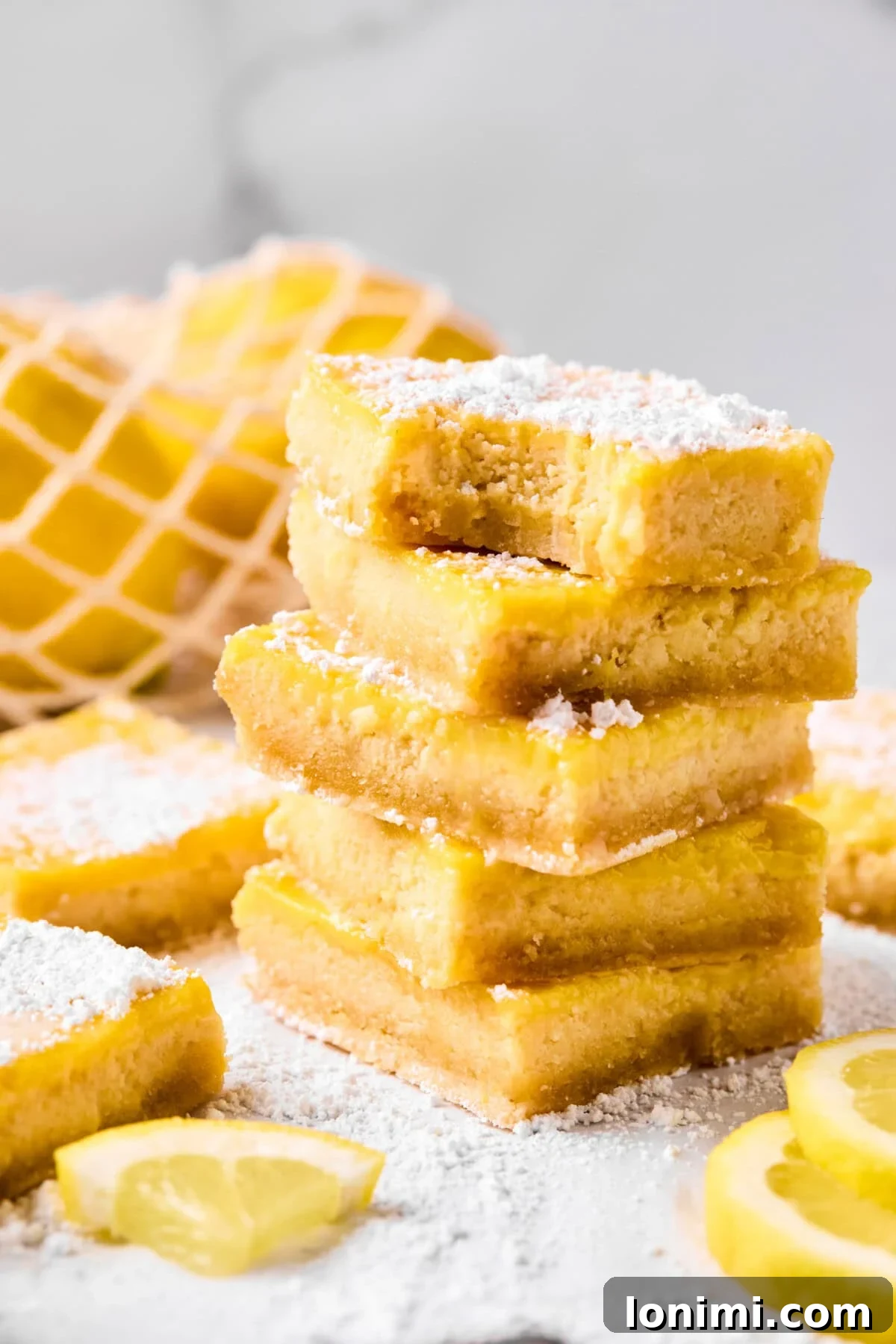 5 lemon bars stacked on top of each other
