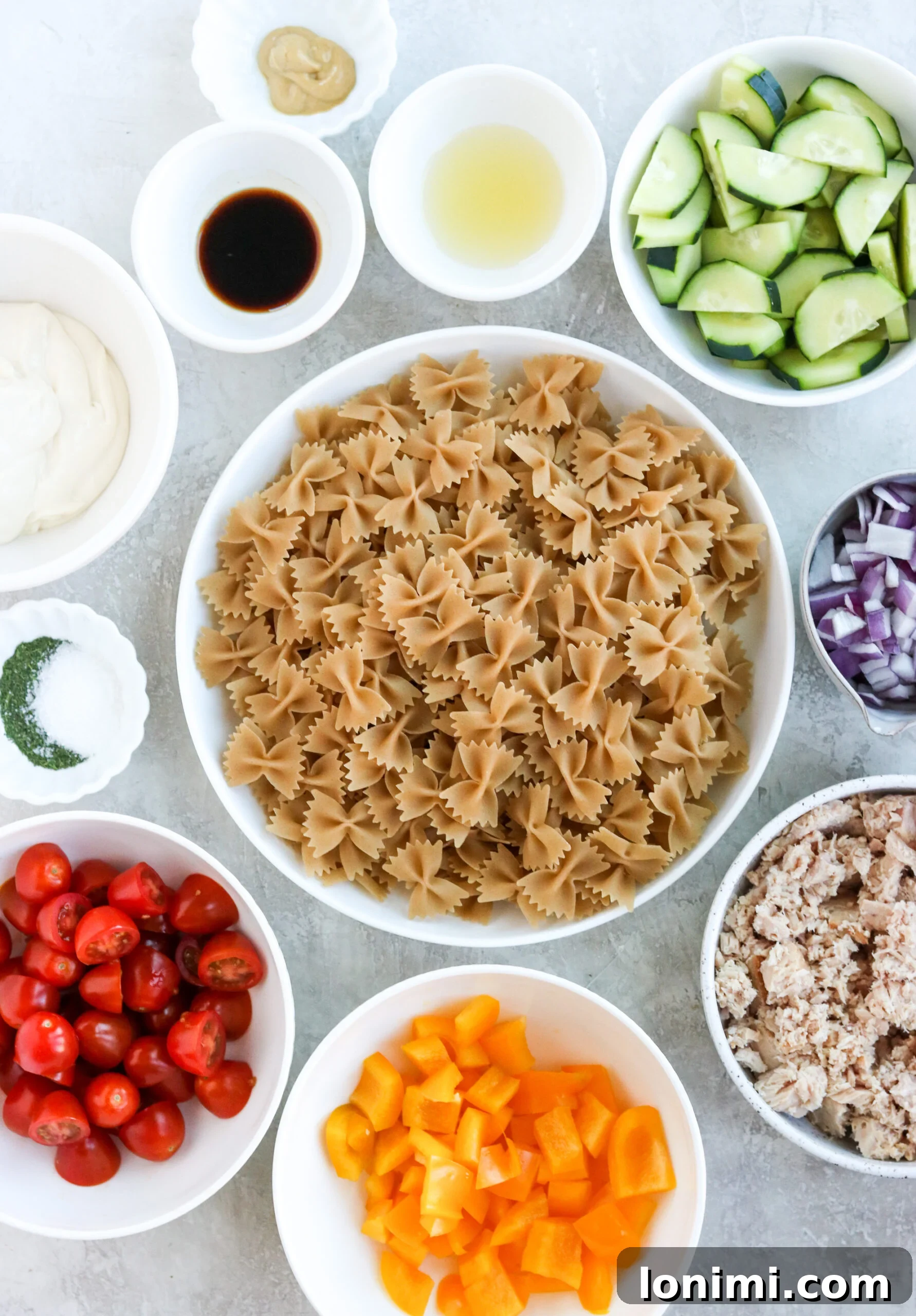 Ingredients laid out for making healthy gluten-free tuna pasta salad.