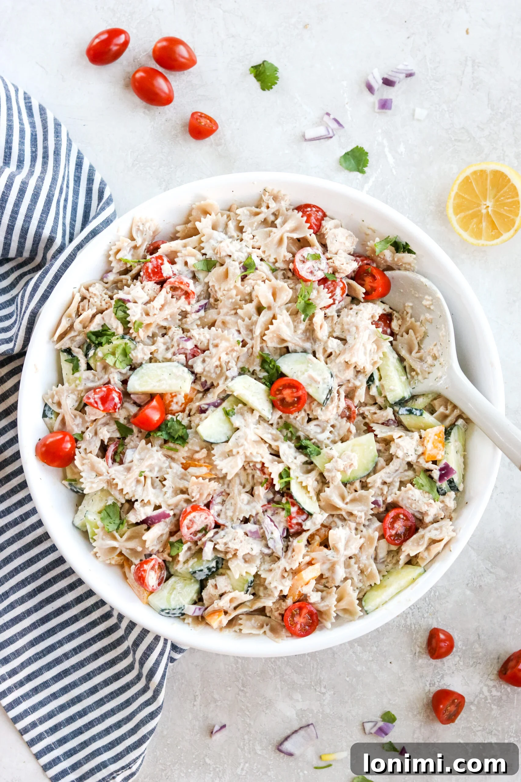 Overhead view of a vibrant gluten-free tuna pasta salad.