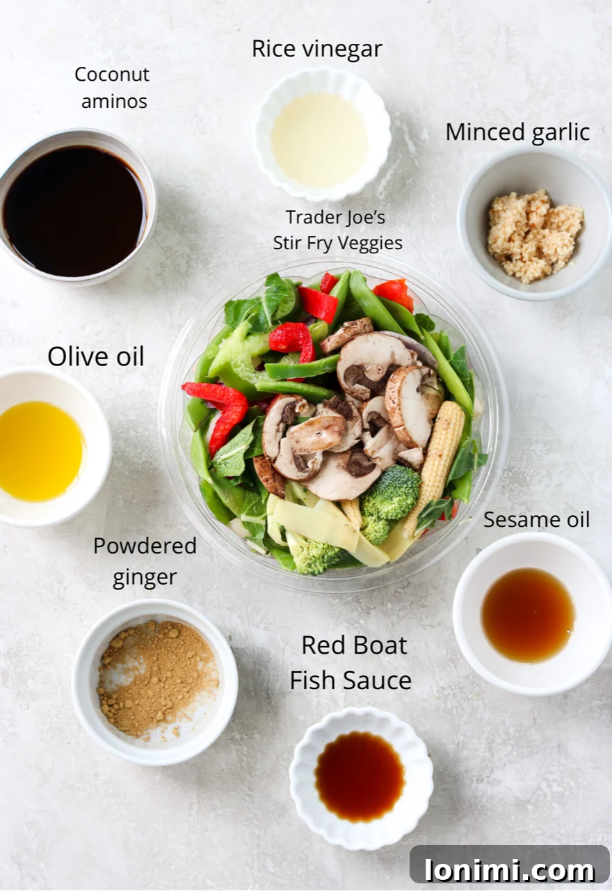 Various fresh ingredients for making Pad Pak stir fry, neatly arranged and labeled.