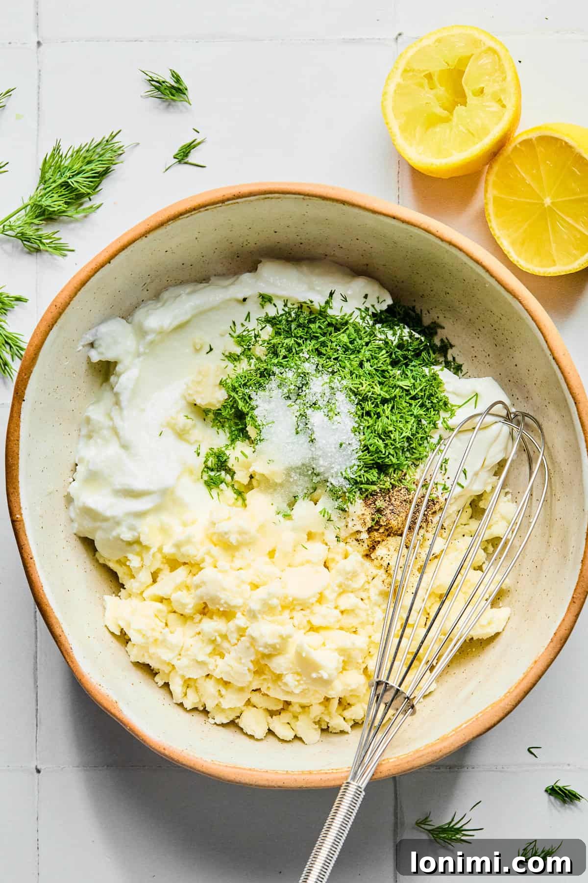 Easy Greek Lamb Meatballs with Zesty Lemon Dill Yogurt 8 Lemon dill yogurt sauce ingredients in a small bowl.