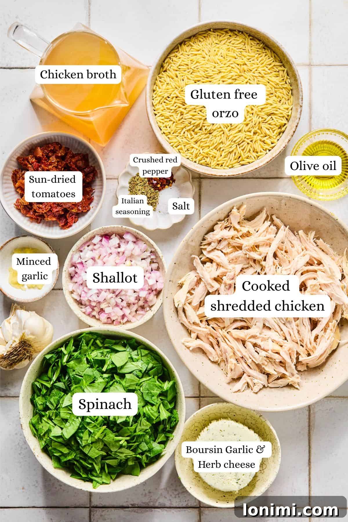 Irresistible Gluten Free Marry Me Chicken Orzo 3 Marry Me Chicken Orzo ingredients labeled and arranged in nesting bowls on a white countertop.