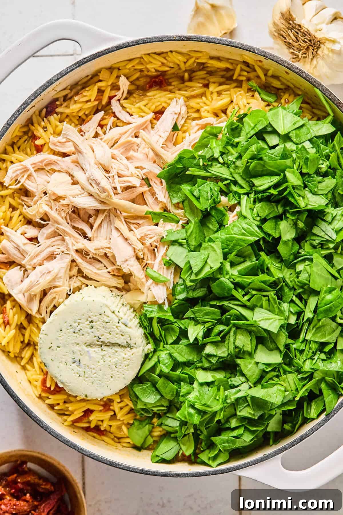 Irresistible Gluten Free Marry Me Chicken Orzo 6 Cooked chicken, spinach, and Boursin cheese in the skillet with the creamy orzo.