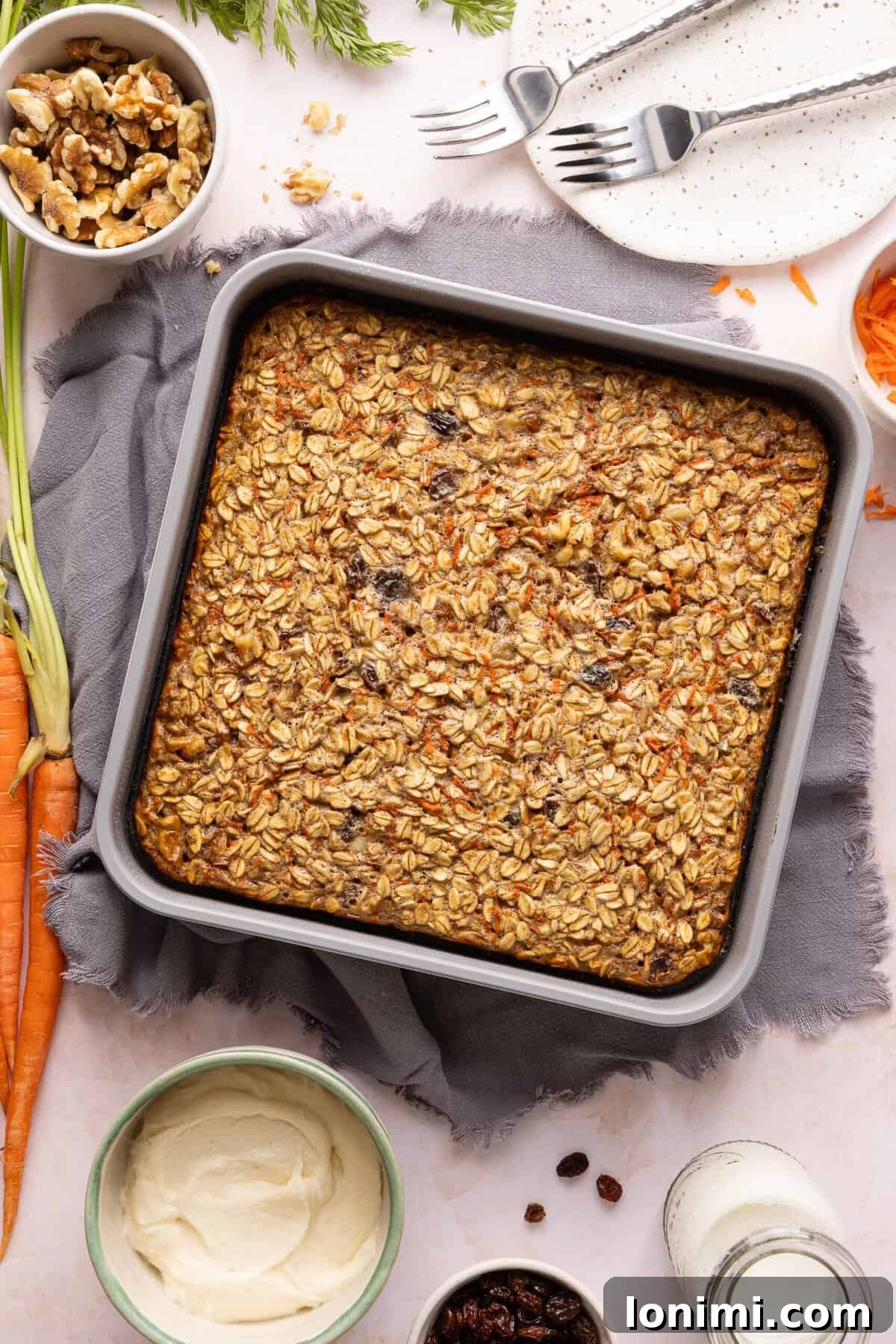 Baked carrot cake baked oats in a metal pan.