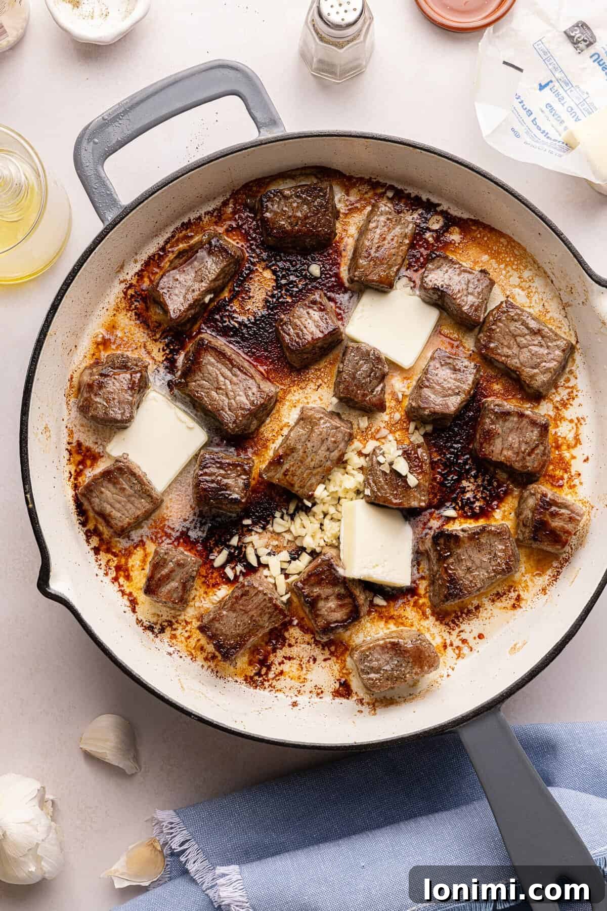 steak bites in a pan with butter