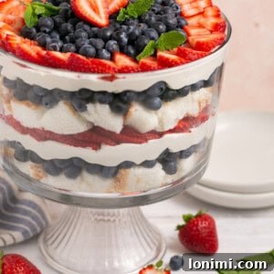 berry angel food trifle with mint in a glass bowl