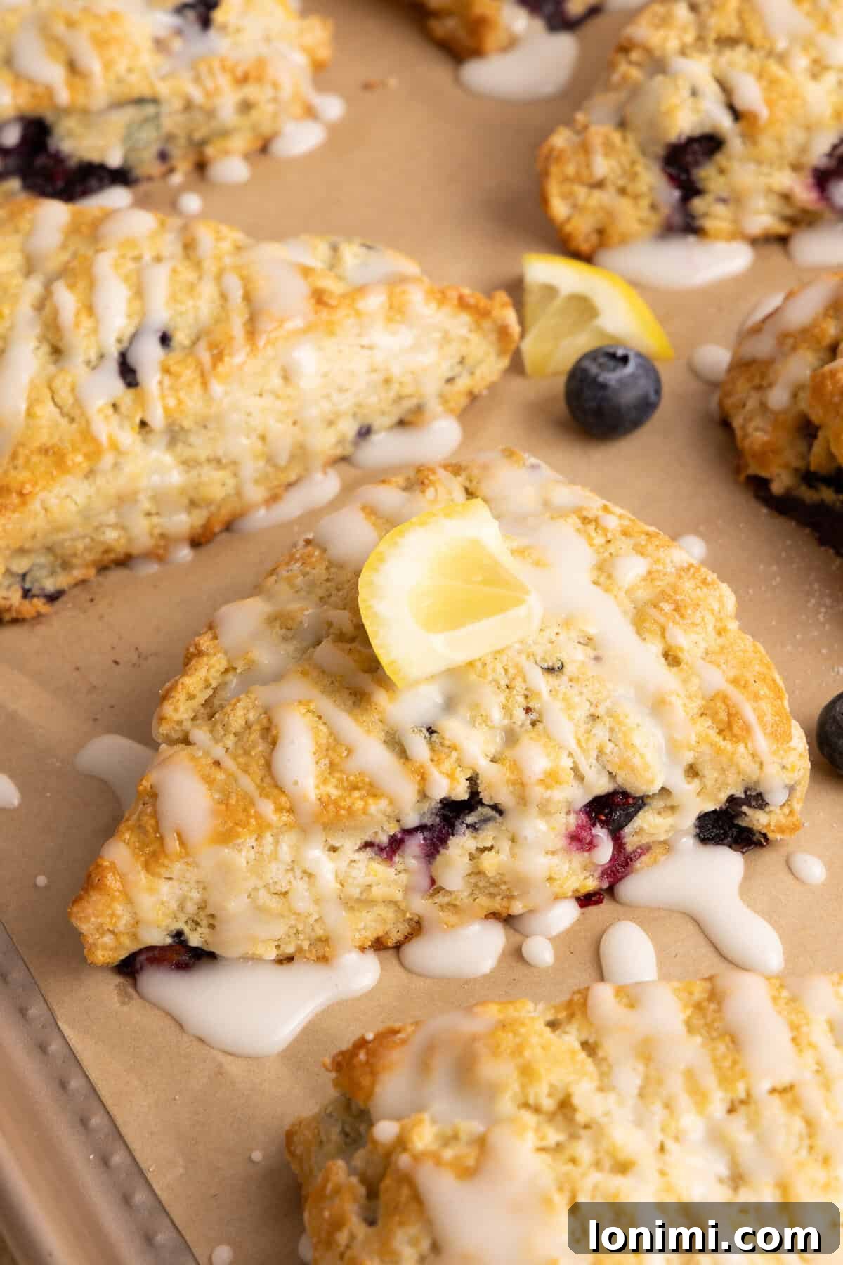 Effortless Gluten Free Blueberry Lemonade Scones 7 blueberry lemon scones on parchment