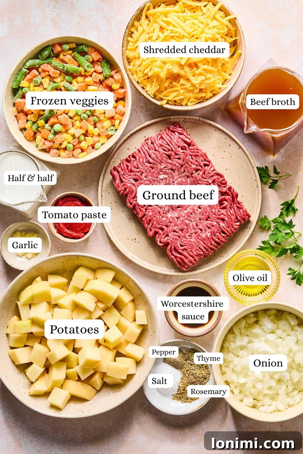 Shepherd's pie soup ingredients, including ground beef, potatoes, vegetables, and seasonings, neatly laid out and labeled.