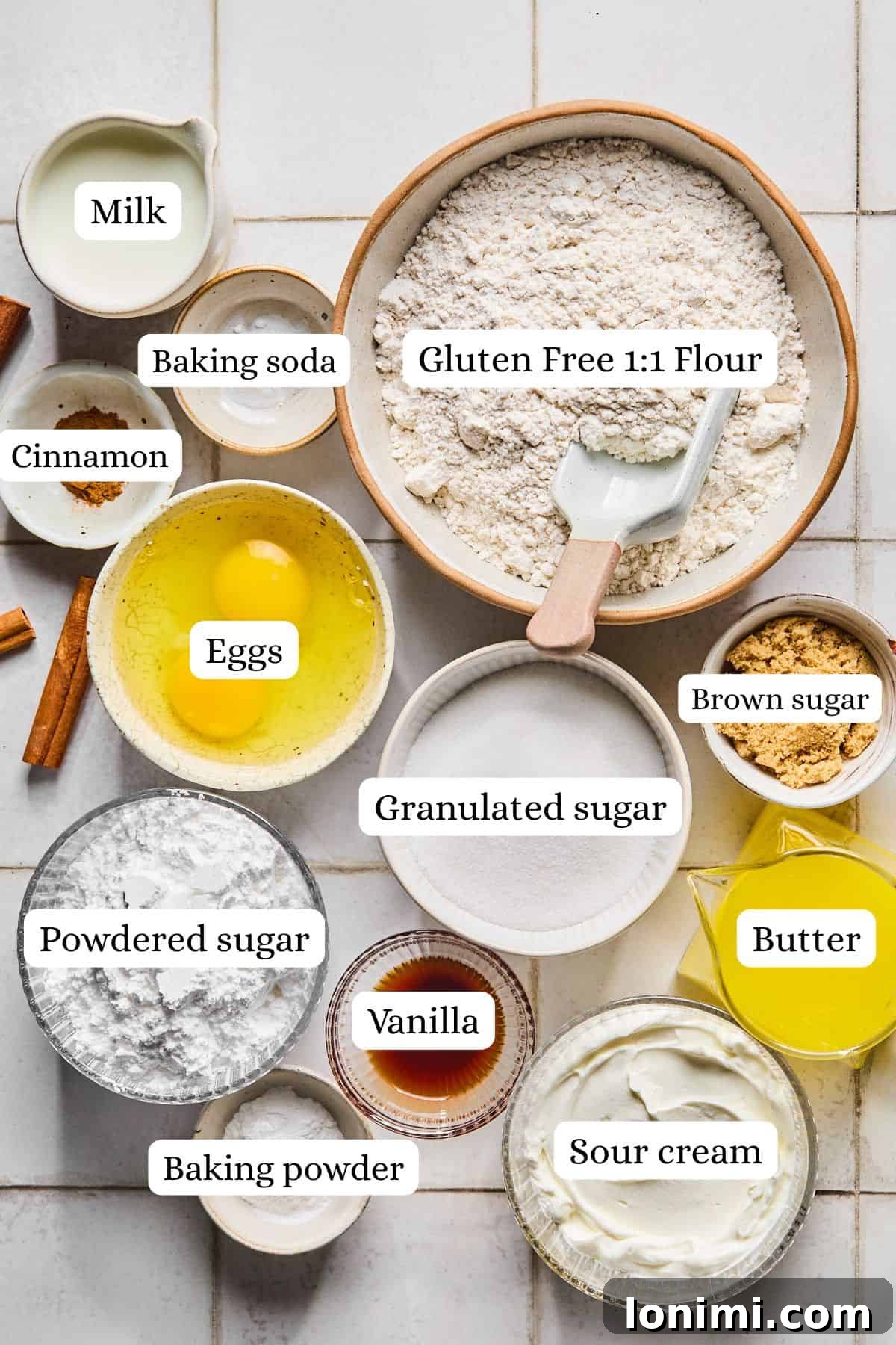 Gluten-Free Coffee Cake Crumble Muffins 3 Bowls of ingredients for coffee cake muffins, including flour, sugar, butter, and cinnamon, neatly arranged.