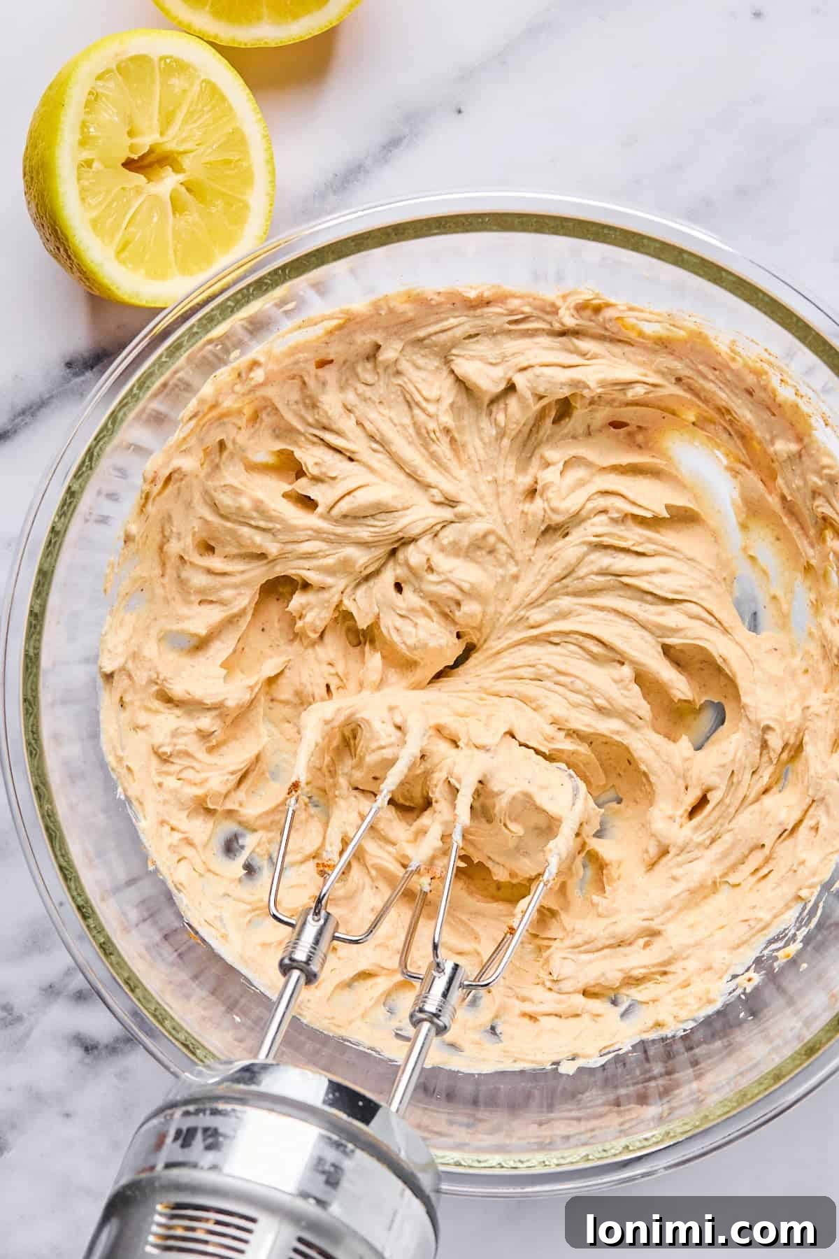 Ultimate Creamy Crab Dip Warm or Cold 4 Cream cheese, Greek yogurt, garlic, and seasonings blended together in a bowl until smooth and creamy