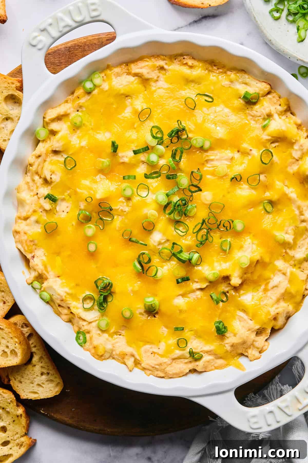 Ultimate Creamy Crab Dip Warm or Cold 8 Hot crab dip baked until bubbly and golden, topped with green onions and ready to serve.