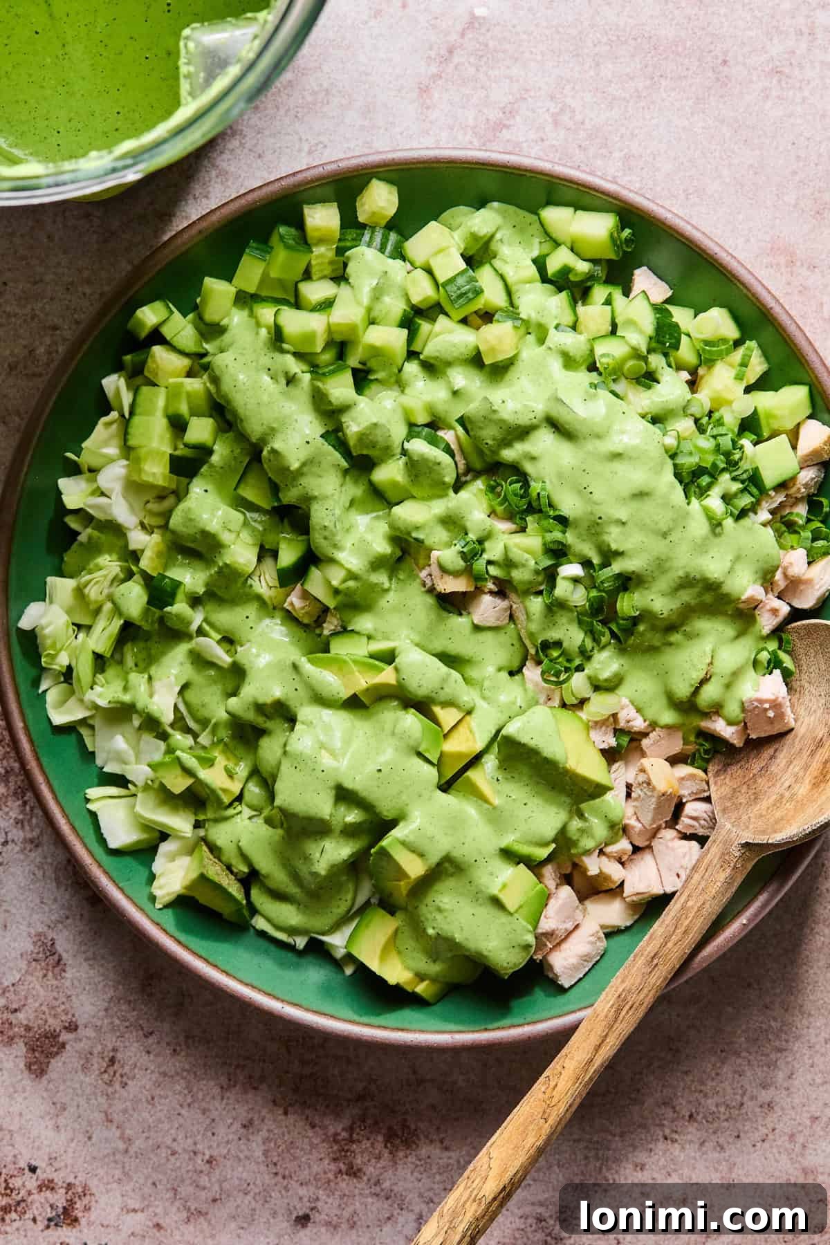 The finished green goddess chicken salad, fully tossed with the dressing and ready to be served.