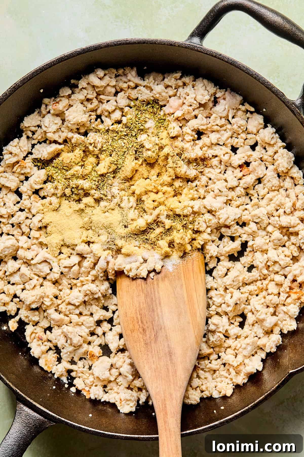 ground turkey in a skillet with seasonings