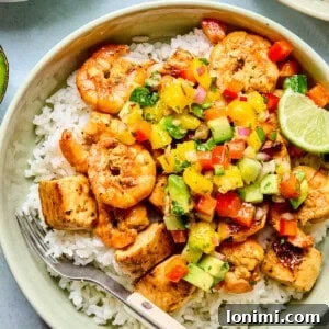 cilantro lime chicken and shrimp over rice with mango salsa
